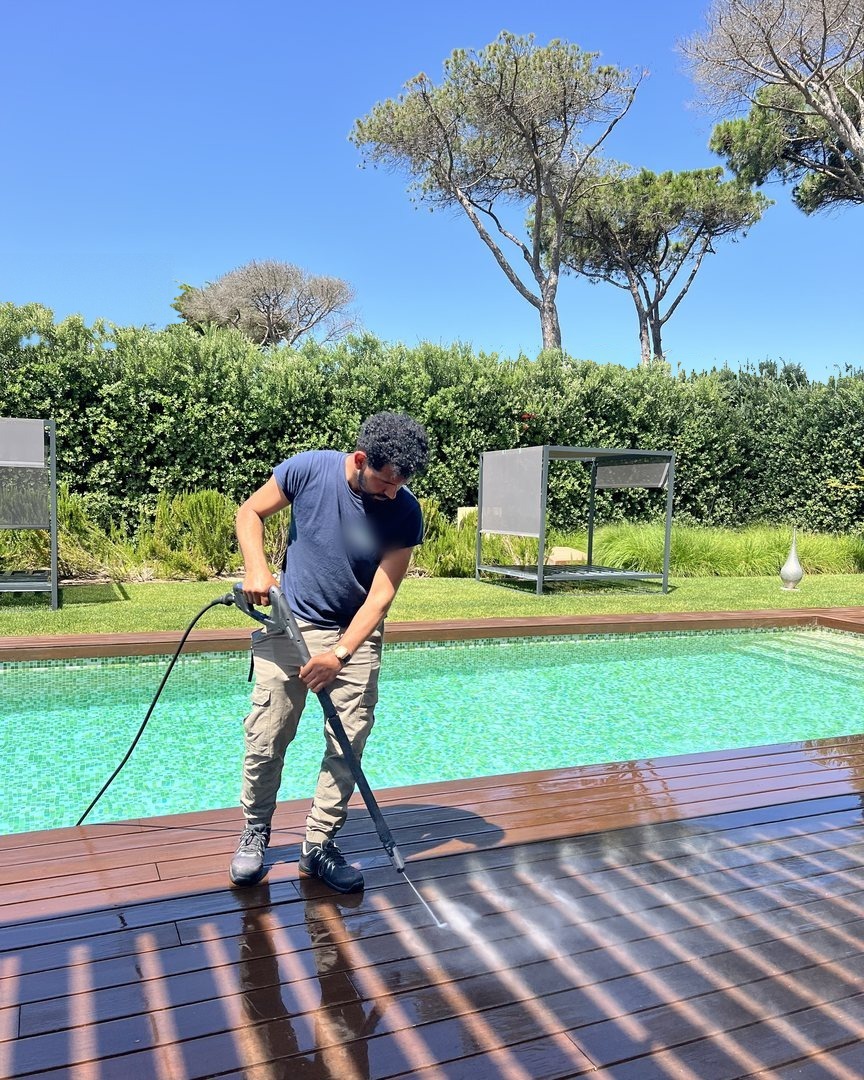 Deck being washed by the pool at a client house