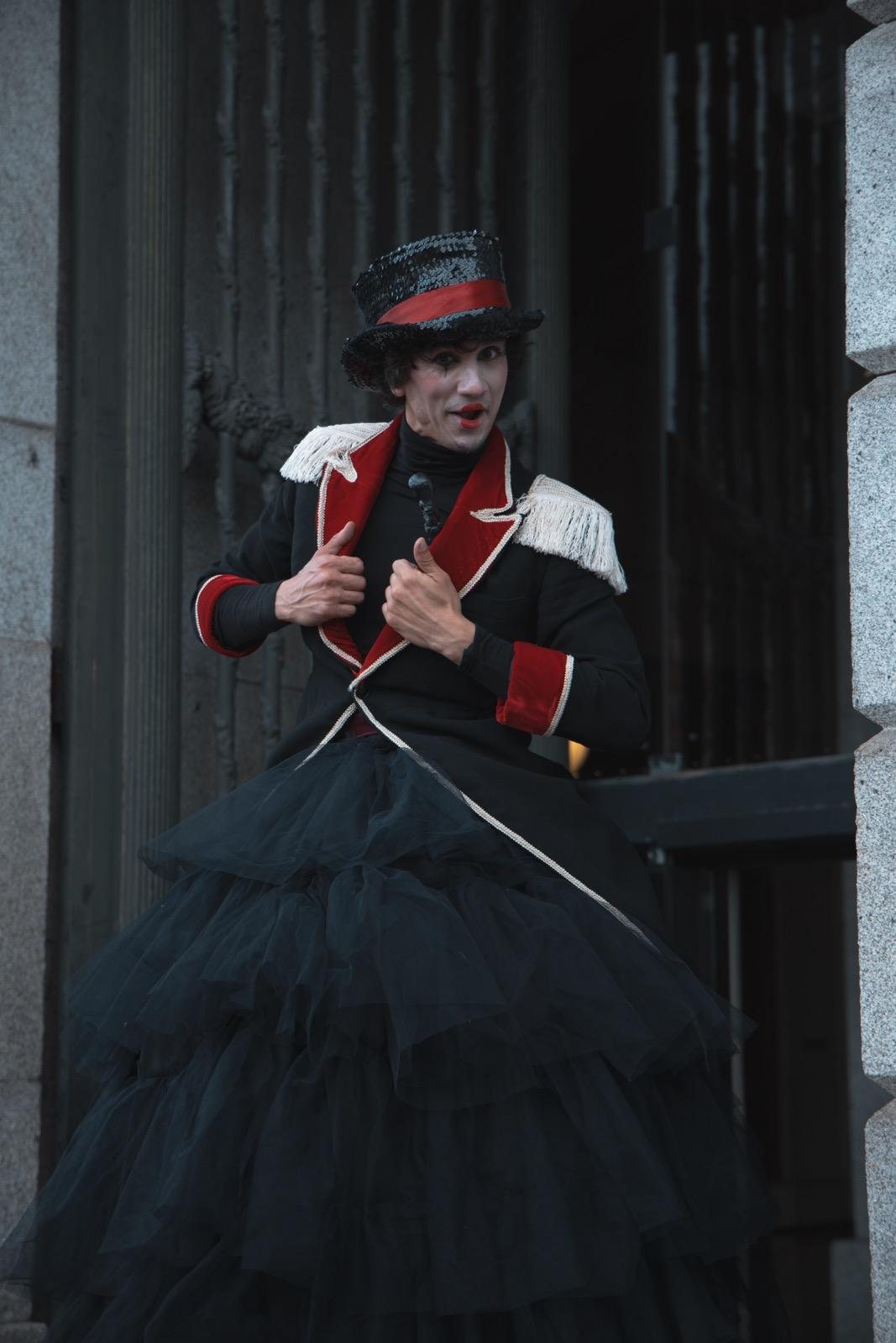A stilt performer in costume at an event produced by Laxmi
